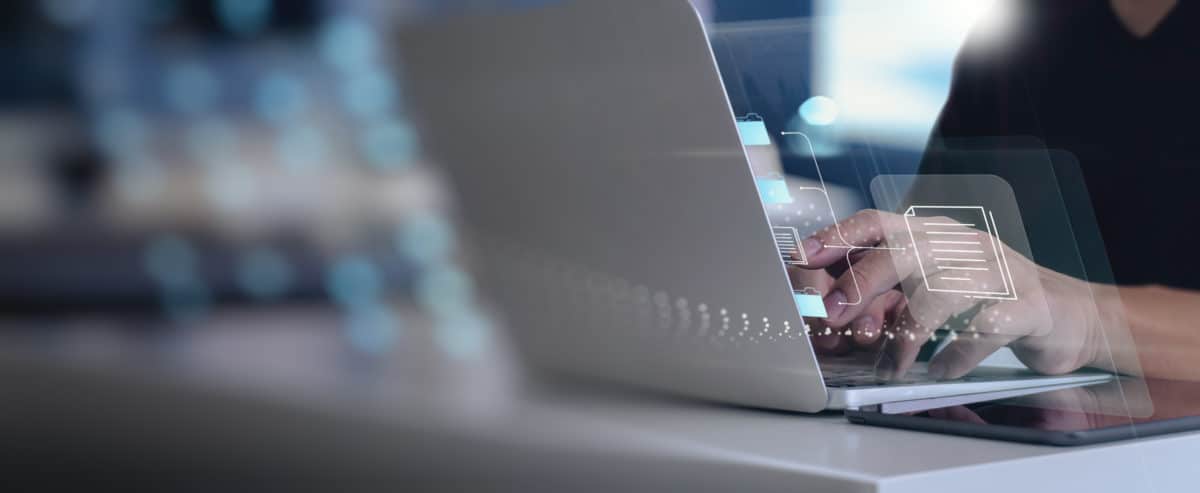 Virtual Compliance Documents Data Management System (DMS) with laptop computer in office
