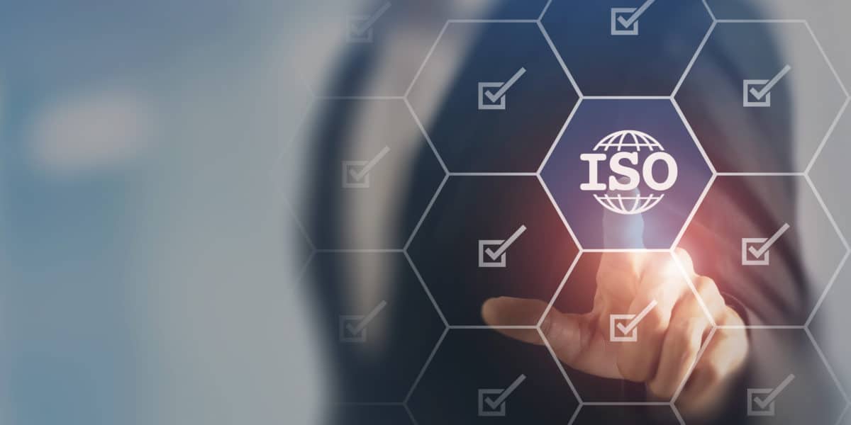ISO standards quality control, assurance and warranty business technology concept. Touching on screen with ISO and globe icons on smart background. ISO Standard certification. Modern ISO banner.
